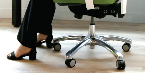 man and woman having a meeting while walking in the office